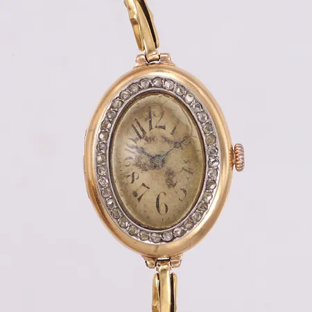 Damur 14K, 28,5x22,5mm, manuell, boettnr: 1210571, diamantkrans med 36st rosenstenar, defekt armband i 18K,säkerhetskedja,  kraftigt slitage på urtavlan, bruttovikt: 18,5g.