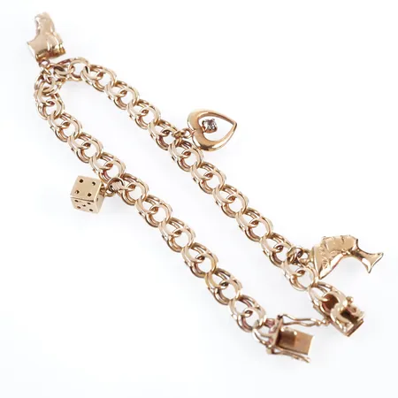 Armband m 4 berlocker, bismarck, 19,5cm, bredd 6mm, 18k Vikt: 16,3 g