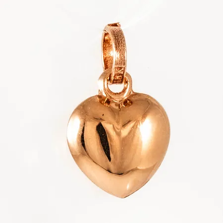Berlock "hjärta" i 18K guld. Den är 13 mm lång inkl. ögla och väger 0,4g. 