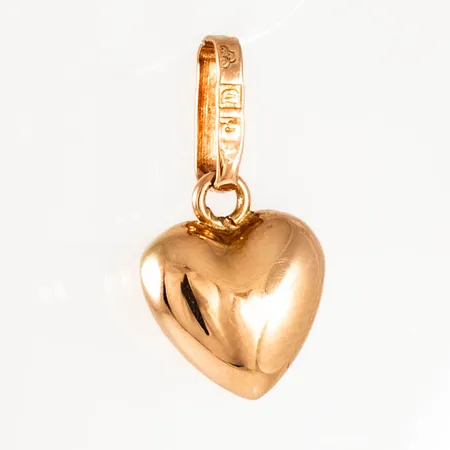 Berlock "hjärta" i 18K guld. Den är 16,3 mm lång inkl. ögla och väger 0,5g. 