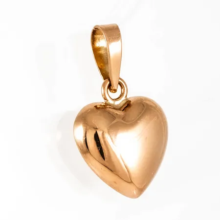 Berlock "hjärta" i 18K guld. Den är 17,5 mm lång inkl. ögla och väger 1,0g. 