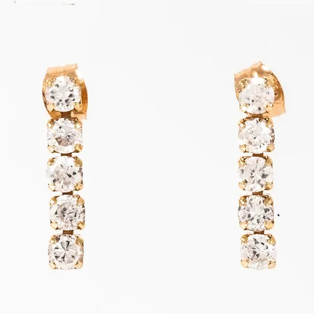 Hängande örhängen i 18K guld med strasstenar. De är 16 mm långa, 3 mm breda och väger 1,5g. 