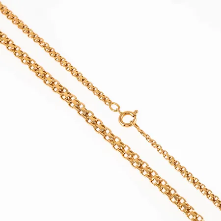 Collier, x-länk i 18K guld. Det är 50 cm långt, 3 - 4,5 mm brett och väger 15,9g. Springring. Två defekta länkpar, knappt synbart.  