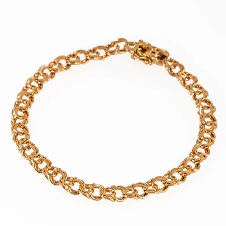 Armband, bismarck i 18K guld. Det är 20 cm långt, 6 mm brett och väger 13,2g. Kistlås. Stämplad NSE, 18K & Kattfot. 
