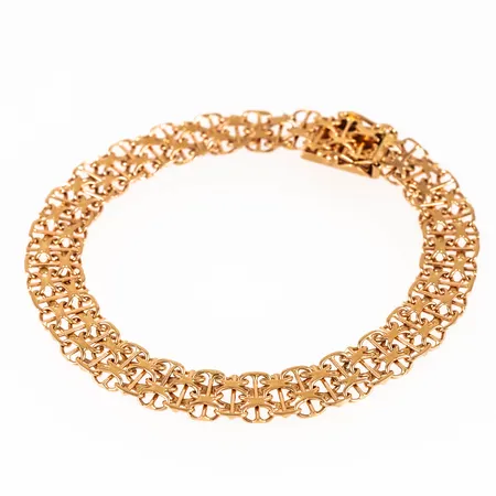 Armband i 18K guld: X-länk med stav. Det är 19 cm långt, 8 mm brett och väger 11,7g. Kistlås. DE, R9, 18K & Kattfot.
