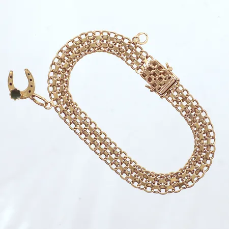 Armband, X länk, en berlock, en ögla till berlock längd 19cm, bredd 8,5mm, Mikkov Ab August Stockholm år 1963,  18k  Vikt: 14,3 g
