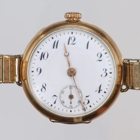 Armbandsur 14K Ø30mm (omgjort fickur) boett nr 224827,  manuell uppdragning, bakboett med monogram, guld i boett, flexlänk i metall, bruttovikt 32,9g 