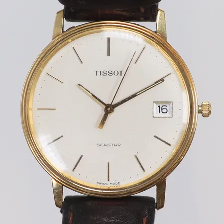 Herrur Tissot Seastar 14K Ø34mm, quartz (går ej), datum, repigt glas, defekt läderband, guld i boett, bruttovikt 30g 