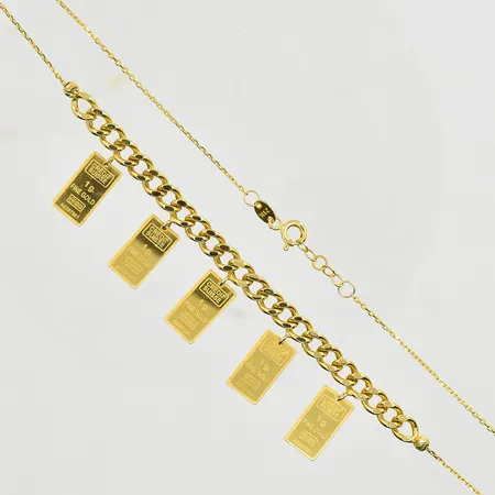 Collier med hängen liknande guldtackor i 21K, doserad, längd 42-43 cm, länkens bredd 1 mm, 21K. Vikt: 7,5 g