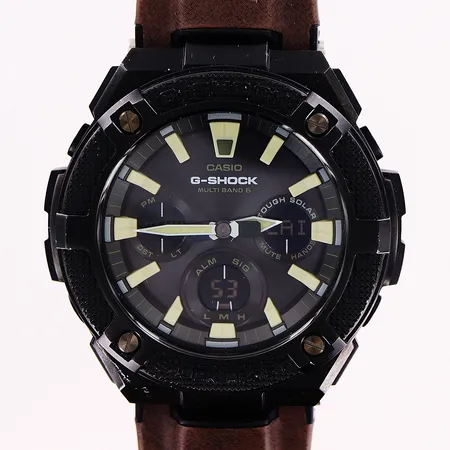 Herrur Casio G-Shock Multiband 6, stål, quartz/solladdningsbar, analog/digital, Ø52mm, svart urtavla, nr GST-W130BC /  002A230H, brunt original textilband, 27cm, inga tillbehör.