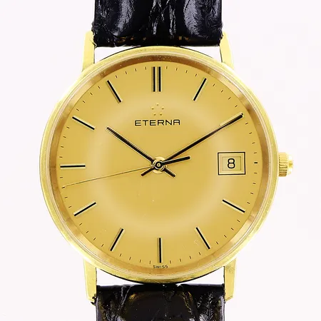 Herrur Eterna, 18K, quartz, Ø33mm, guldfärgad urtavla, datum sekundvisare, gravyr, svart läderband Rocket, inga tillbehör.