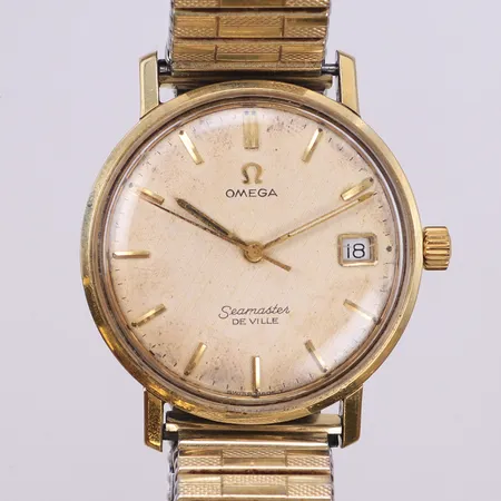 Herrur, Omega Seamaster De Ville, Ø34mm, guld på stål, manuell, ny originalkrona, datum, fläckar på visare och urtavla, repor på plexiglas samt boett, flexband, inga tillbehör.  Vikt: 0 g