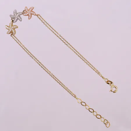 Armband med sjöstjärnor och vita stenar, ca 16,5-19,5cm, bredd 1,5-8,5mm. 18K Vikt: 3,2 g