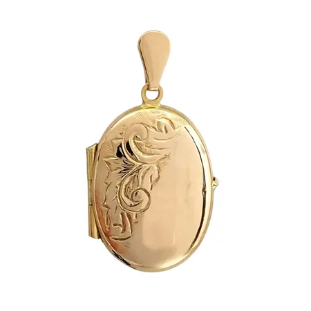 Hänge Medaljong, 18K guld, mönstrad framsida, Guldfynd (GFAB), längd inkl. ögla 28 mm, bredd 15 mm, tjocklek 5 mm Vikt: 2,6 g