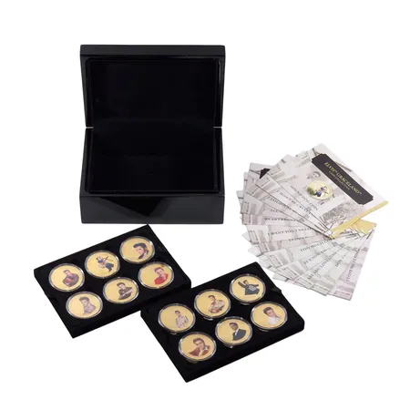 SET - Elvis Presley "Elvis Graceland 60th Anniversary Coins Collection", 12 stycken, utgivna av The Bradford Exchange, Ø39 mm, överdragna med 24K guldplätering, förvaras i myntkapslar, originaletui (pianolack)+ tillhörande informationsblad för varje mynt, mycket fint skick, vikt omkring 1000 gram
