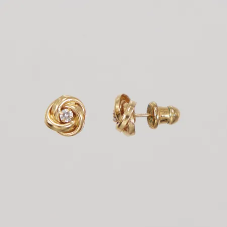 Ett par örhängen, knutar med vita stenar, Ø ca 8,4mm, stoppar ej guld, 18K. vikt 1g exklusive stoppar