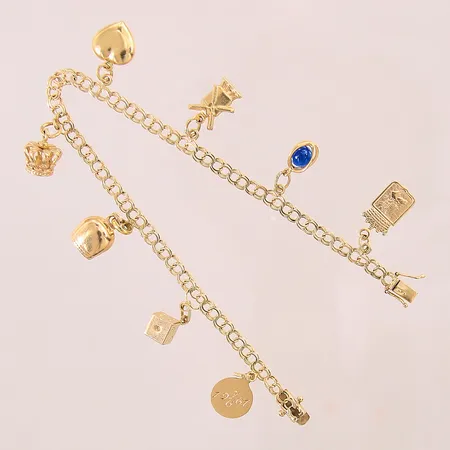 Armband Bismarck med 8 berlocker, längd: 19cm, bredd: 3,8-10m, 18K  Vikt: 10,1 g