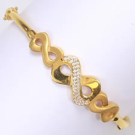 Armring med vita stenar, öppningsbar, ca 60x55mm internt, bredd 3-12mm, 21K Vikt: 11,8 g
