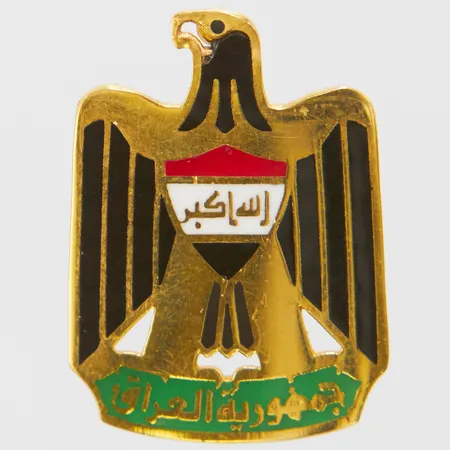 Hänge, Iraks riksvapen, längd ca 22, bredd 16mm, skadad emalj vid näbben, 18K Vikt: 2,3 g