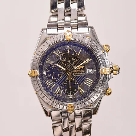 Herrur Breitling Crosswind, 43mm, stål/guld, automatisk, ref:B13355, snr: 286604, Cal.B13 (7750), safirglas, datum, kronograf, pilotlänk, totallängd: 19,6cm, viklås, färgbortfall på krona samt pushers, en raider något sned, bruksslitage, reseetui.