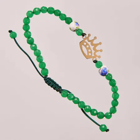 Stenarmband med gulddetaljer i 18K ca 1g, ca 17cm, bruttovikt 3,9g.