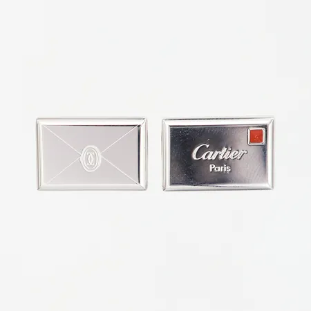 Ett par manchettknappar, Cartier 14x20mm, silver 925/1000, vitmetall, certifikat, originaletui, vikt: 21,1 gram Vikt: 21,1 g