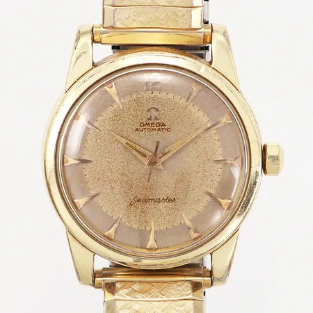Herrur Omega Seamaster, Ø34mm, automatisk, guld på stål, flexband, 1950-60 tal, slitage på plexiglas samt boett