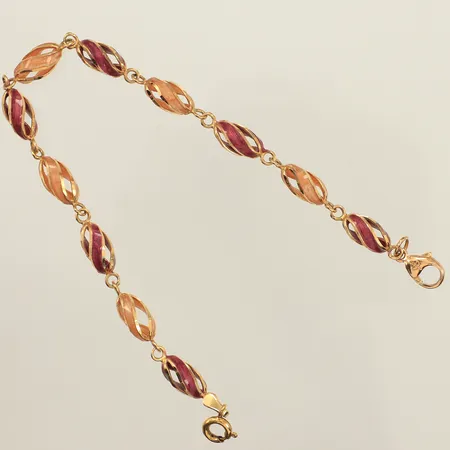 Armband, emalj, längd 19,5cm, bredd 5,5mm, två lås, varav ett i metall, 18K bruttovikt: 6,9g 