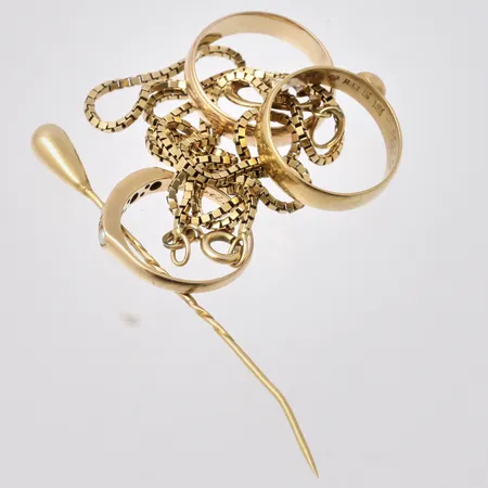 Diverse defekt guld, 18K, vikt 18,39g.