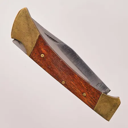 Fällkniv, ca 18cm, trä och mässing. Vikt: 0 g