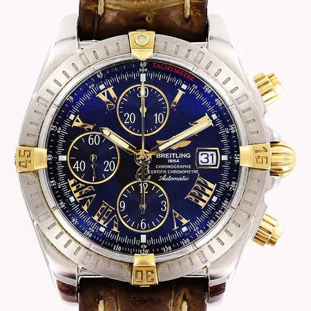 Herrur Breitling Chronomat Evolution, modell B13356, stål/guld, automatisk, Ø44mm, svart urtavla, datum, kronograf, serie nr 2460628, rist nr Y90264, läderband 25cm, törnlås, slitage på bandet, tygetui, inga övriga tillbehör. Vikt: 0 g