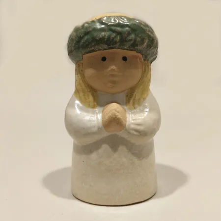 Figurin, ljusstake Lucia, ur serien Adventsbarn, Lisa Larson för Gustavsberg, ca 11cm, stearinrester, märkt. 