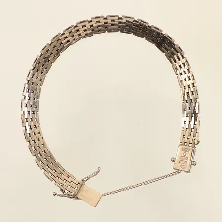 Armband Korridor, längd 18cm, bredd 7,3mm, säkerhetskedja, Hedens Guldatelje Bröderna Stockholm år 1975, behov av omrodiering, vitguld, 18K  Vikt: 25,5 g