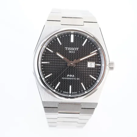 Herrur Tissot PRX Powermatic 80 i stål. Boett Ø 40 mm med glasbaksida. Automat. Svart urtavla. Safirglas. Ref. T137.407.11.051.00, box & cert, mycket bra skick.