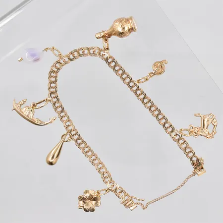 Armband Bismarck med 7 berlocker, 18,5cm, bredd ca 5mm, säkerhetskedja, 18K Vikt: 15,7 g