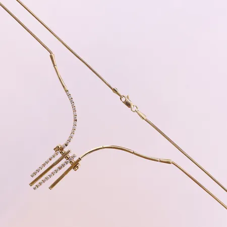 Collier med vita stenar, ca 52cm, bredd 2-12mm. 14K  Vikt: 11,3 g