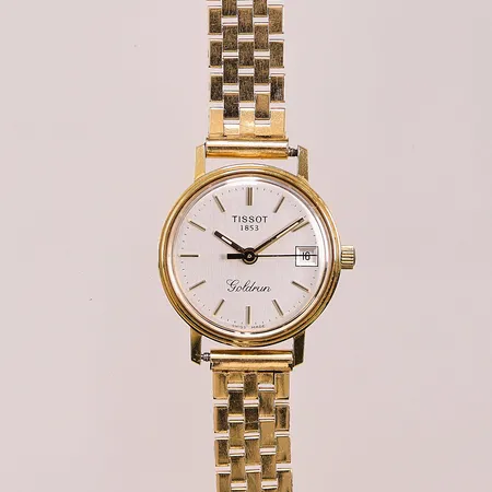 Damur Tissot 18K, 22mm, quartz, går ej, graverad, länk i 18K bruttovikt 32,7g.
