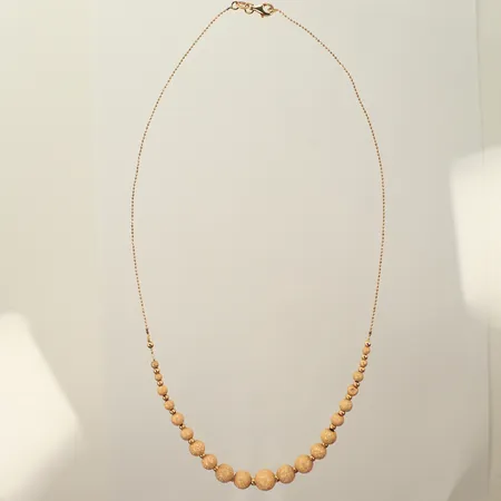 Halsband med kulor, längd 45,5cm, bredd 1-7mm, lagning vid ena kulan, 18K, 5,7g 