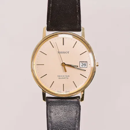 Herrur Tissot Seastar 14K, 34mm, quartz (går ej), datum, defekt läderband, gravyr, krona saknas, bruttovikt 24,8g.