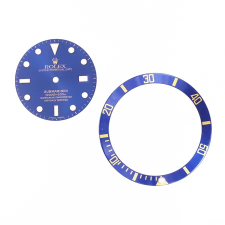 En Rolex urtavla till Submariner med tillhörande bezel insert.