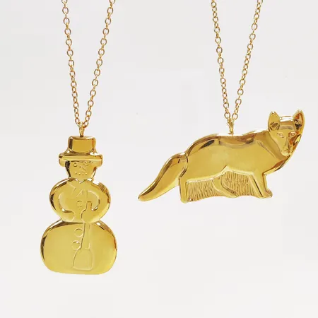 2 Juldekorationer, Georg Jensen, Golden Christmas 1999 samt 2002, höjd: ca.3-5,5cm, guldpläterad mässing, i orginalförpackningar. 