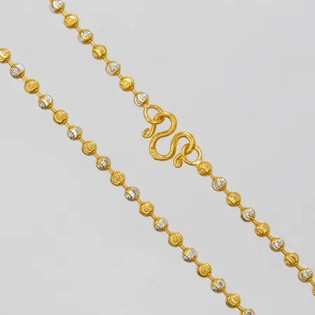 1 Collier, tvåfärgade kulor med facettering, längd: ca.43,5cm, bredd: 2,8mm, Thaiguld 1 Baht, 23K Vikt: 15,2 g