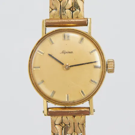Damur Alpina 18K, manuell, 24mm, boettnr: 257813, metallband kraftig slitet, repat glas, kronan i gulmetall, inga tillbehör, bruttovikt: 28g.
