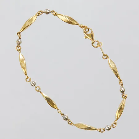 Armband, ihåligt, längd: 18,5cm, bredd: 2,8-3,5mm, ledad, facetterade kulor med rodiumplätering, bucklor, GHA, 18K Vikt: 3,6 g