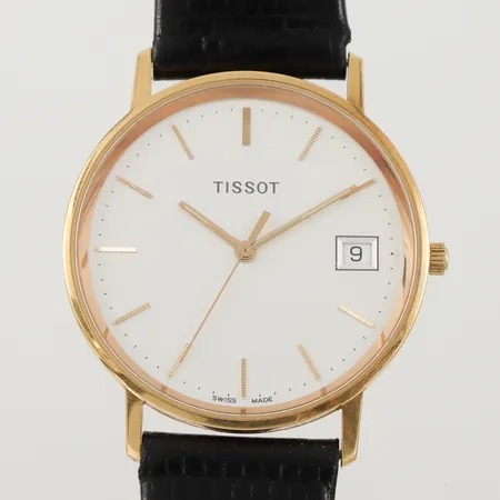 Herrur Tissot med gravyr, diameter 33.3 mm, i behov av batteribyte,18k.OBS! Skickas tidigast 4/8 pga. semesterstängt. Vikt: 0 g