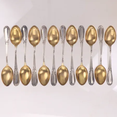 12 Skedar, längd 10,5cm, delvis förgyllt silver 830/1000 Vikt: 129,7 g