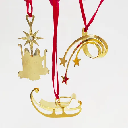 3 Juldekorationer, Georg Jensen, Christmas Classics 2006 samt Christmas Collectibles 2012, höjd: ca.3-7cm, guldpläterad mässing, vita stenar, i orginalkartong. 