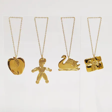 4 Juldekorationer, Georg Jensen, Golden Christmas 2000 samt 2001, höjd: 3-5,7cm, guldpläterad mässing, i orginalförpackningar. 