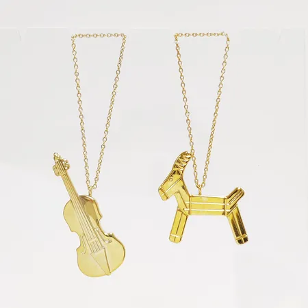 2 Juldekorationer, Georg Jensen, julbock höjd: ca.4,4cm,  fiol höjd: ca.6,3cm, guldpläterad mässing, i orginalförpackningar. 