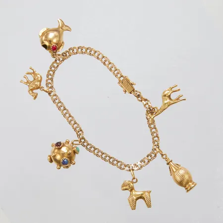 Armband, Bismarck med sex integrerade berlocker, färgade stenar, längd: 19,5cm, bredd: 4,2-4,3mm, svenska stämplar, 18K Vikt: 19,2 g